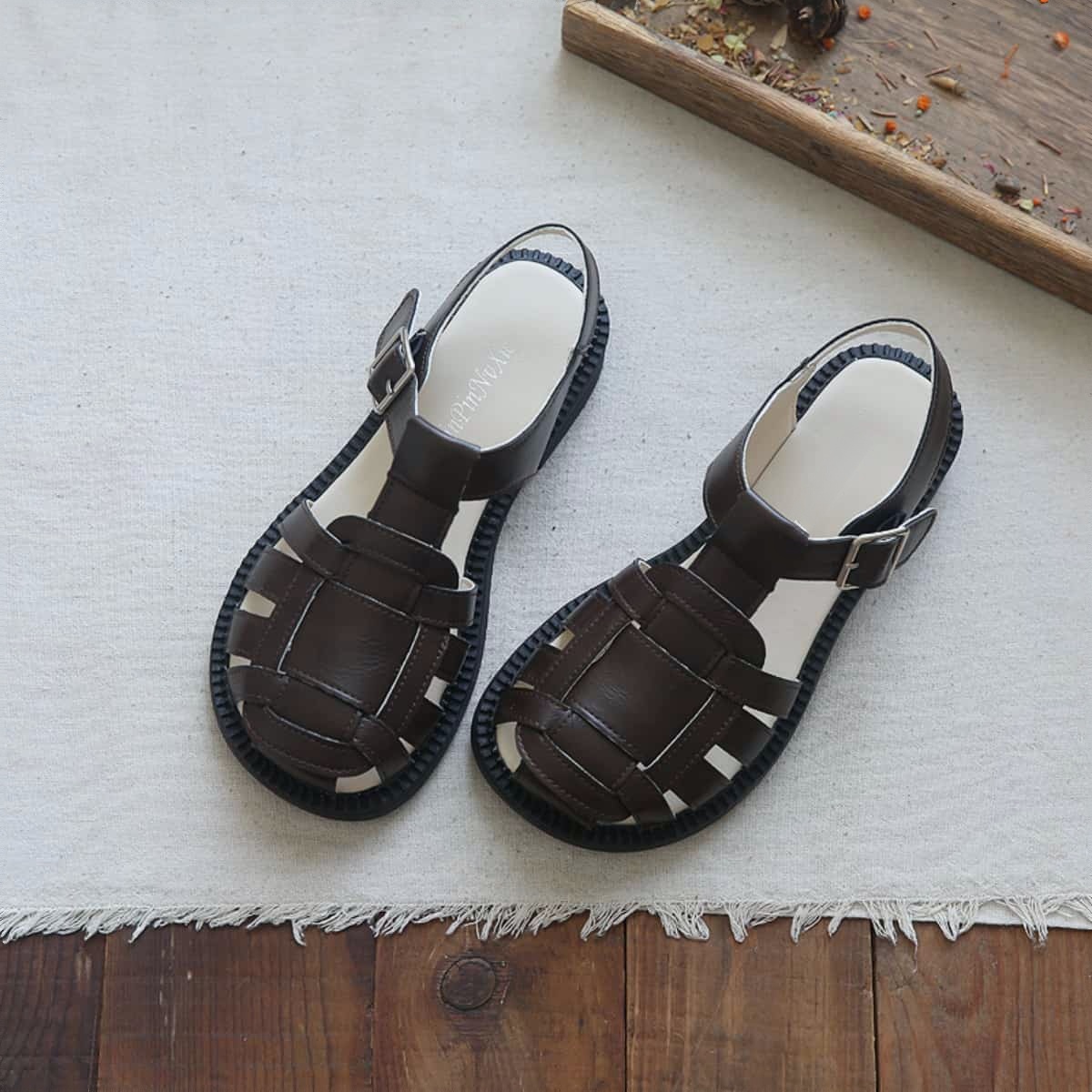 Hollow glossy bag head flat-soled big head shoes summer middle heel French Roman sandals