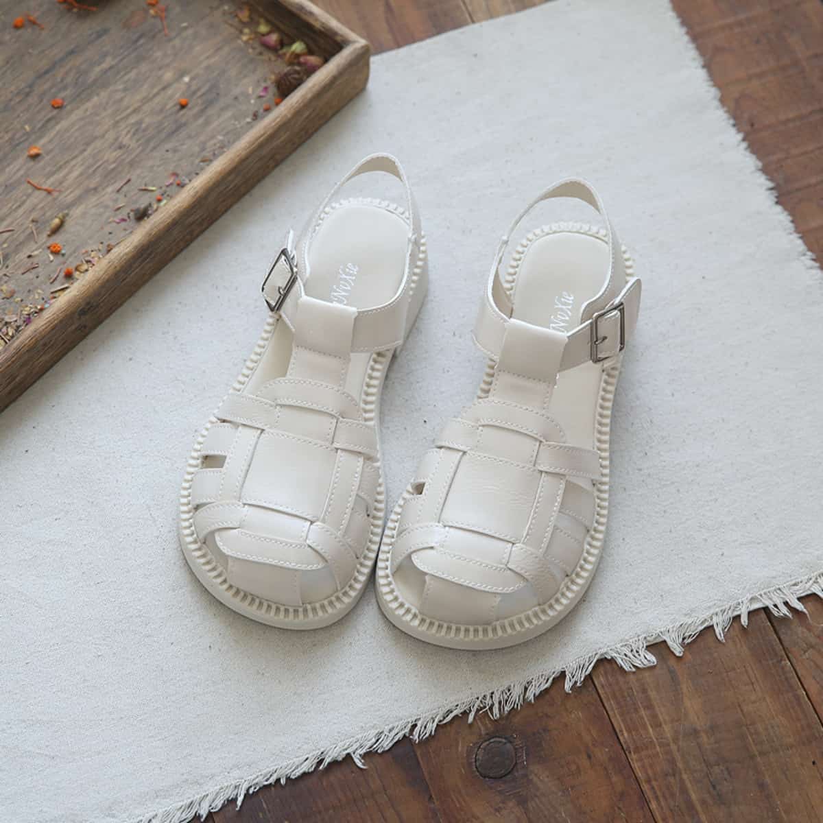 Hollow glossy bag head flat-soled big head shoes summer middle heel French Roman sandals